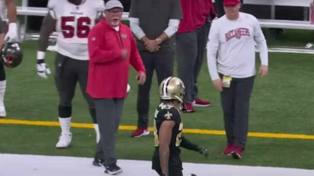 Former Buccaneers coach screams at Saints defensive back Marshon Lattimore.